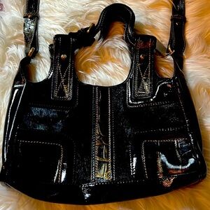 Black leather bag with thick shoulder strap in excellent condition.